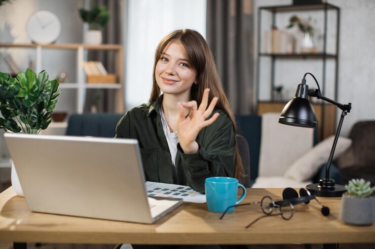 beautiful-caucasian-woman-with-long-dark-hair-sitting-desk-typing-laptop_161094-9174.jpg